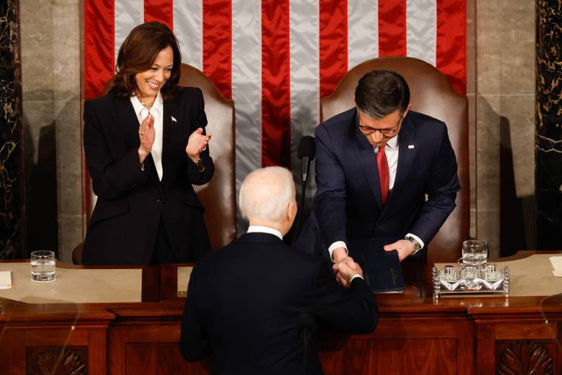 WASHINGTON, DC - MARCH 07: U.S. President Joe Biden shakes hands with Speaker of the House Mike Johnson (R-LA) as Vice President Kamala Harris watches during the State of the Union address during a joint meeting of Congress in the House chamber at the U.S. Capitol on March 07, 2024 in Washington, DC. This is Biden’s last State of the Union address before the general election this coming November. (Photo by Chip Somodevilla/Getty Images)