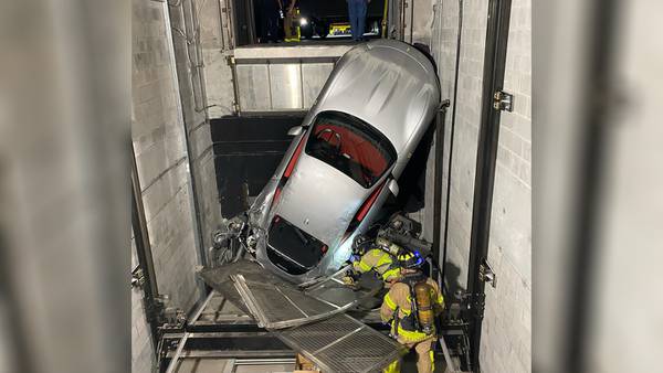Photos: Elevator malfunction at Ferrari dealership leaves car hanging