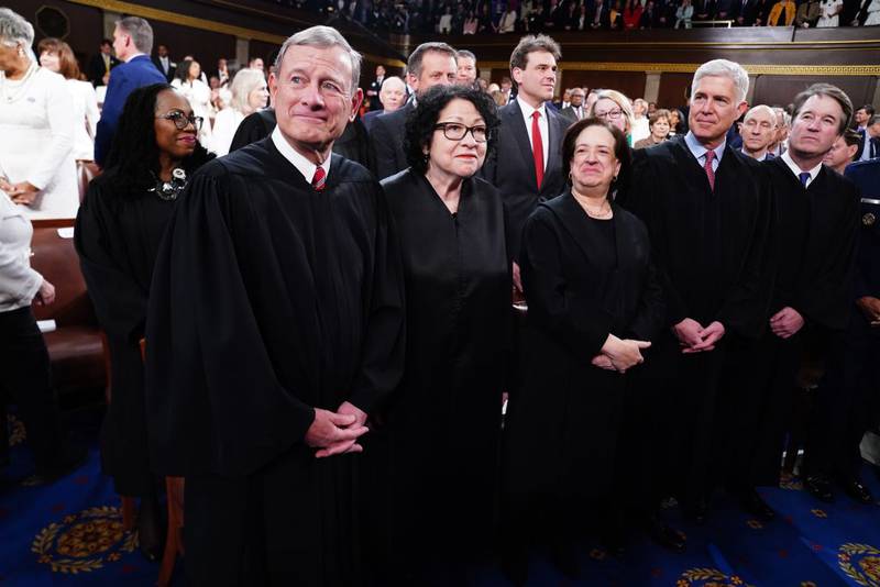 WASHINGTON, DC - MARCH 7:  U.S. Supreme Court Chief Justice John Roberts (L) and Associate Justices (L-R) Sonia Sotomayor, Elena Kagan, Neil Gorsuch and Brett Kavanaugh stand on the House floor ahead of the annual State of the Union address by U.S. President Joe Biden before a joint session of Congress at the Capital building on March 7, 2024 in Washington, DC. This is Biden's final address before the November general election.  (Photo by Shawn Thew-Pool/Getty Images)