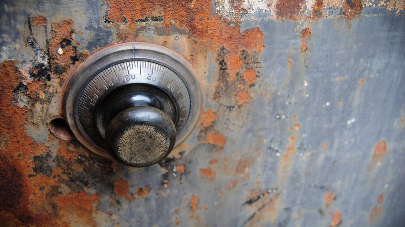 close-up of old rusted safe knob