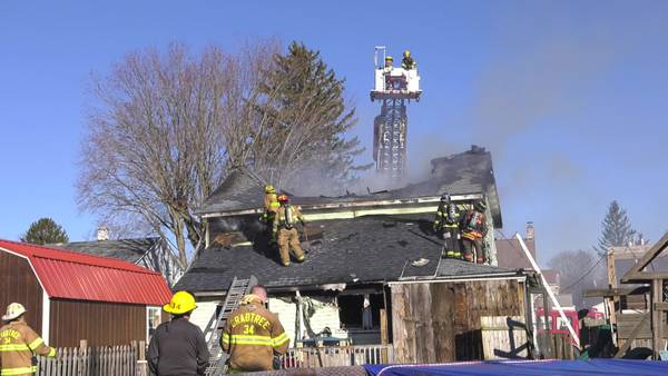 Fire burns hole through roof of house in Unity Township