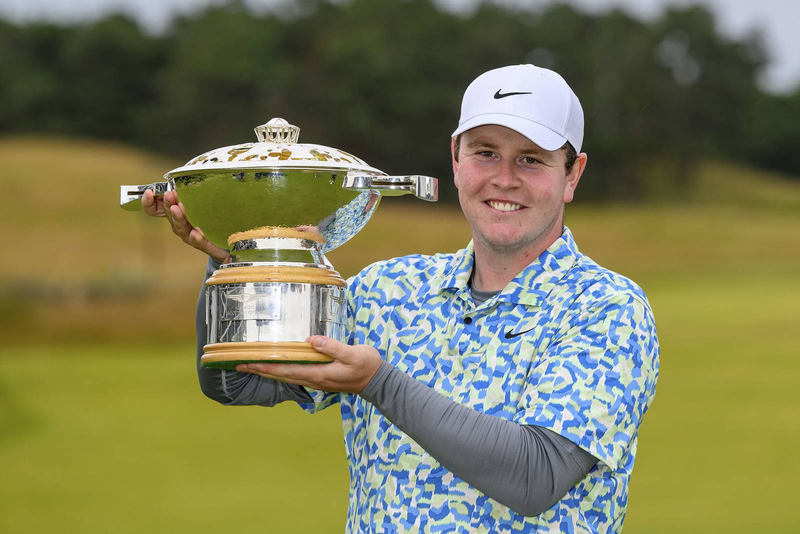 MacIntyre wins his national open in Scotland with birdie to beat Adam