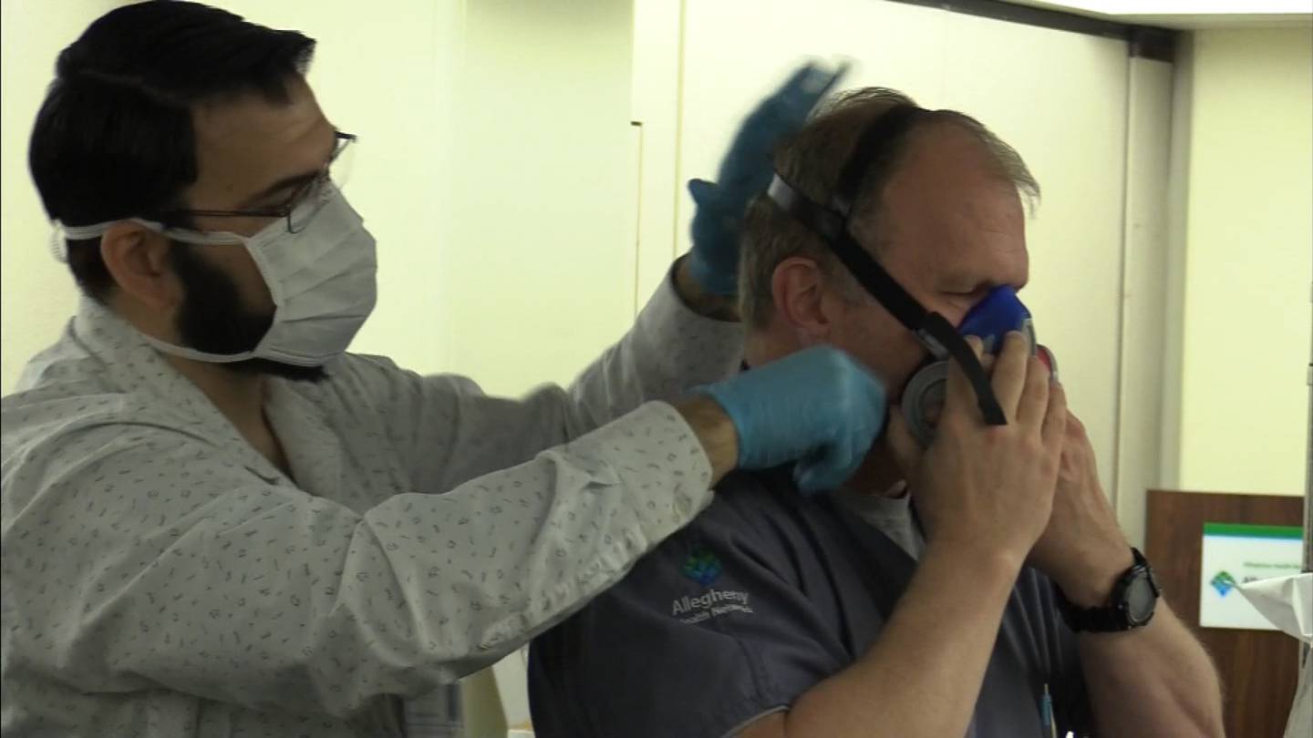 Frontline AHN caregivers using industrial grade respirator masks during