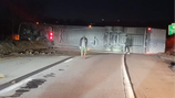Tractor-trailer rolls over on I-70, hazmat crews called to the scene