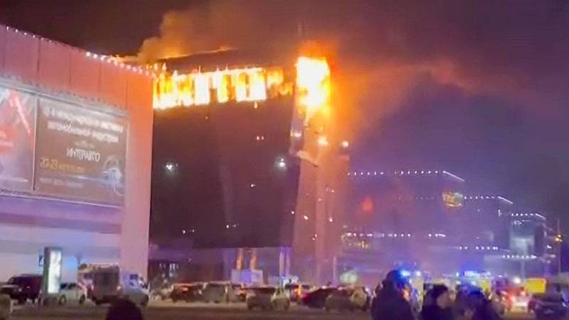 MOSCOW, RUSSIA - MARCH 22: A screen grab from a video shows smoke rises from fire as ambulances, personnel arrive at Crocus City Hall concert venue near Moscow, Russia after reports of a shooting incident on March 22, 2024. Gunmen killed 40 people and over injured 100 others in a shooting at a concert hall near Moscow, the Russian Federal Security Service (FSB) announced on Friday. (Photo by Ali Cura/Anadolu via Getty Images)