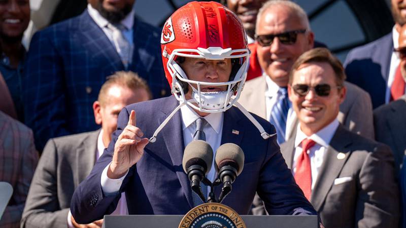 Joe Biden wears Chiefs helmet