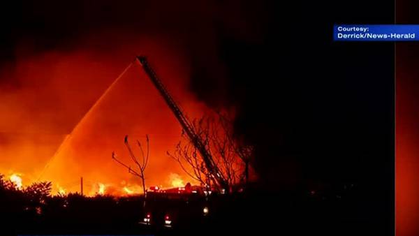 Firefighters hurt battling massive lumber yard fire