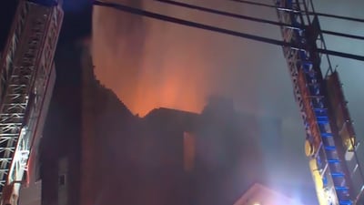 PHOTOS: Fire tears through roof in East Pittsburgh structure fire