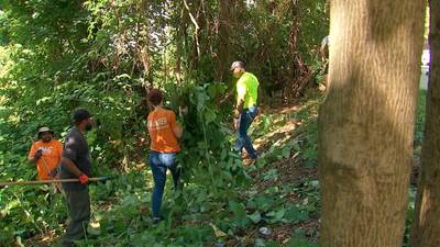 Volunteers cleaning up vacant lots in Pittsburgh’s Hill District neighborhood in honor of Juneteenth