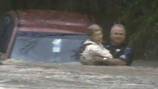 Police sergeant recounts risking his life to save woman trapped in Ivan flood waters 20 years ago