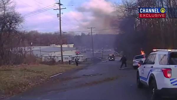 Video shows police officers rescuing man from burning car following crash in Butler Township
