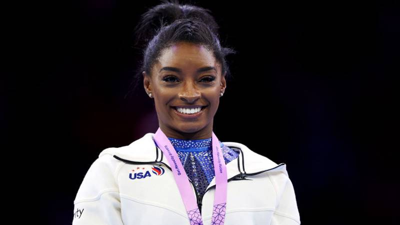 ANTWERP, BELGIUM - OCTOBER 06: Gold medalist Simone Biles of Team United States reacts during the medal ceremony for the Women's All Around Final on Day Seven of the 2023 Artistic Gymnastics World Championships at Antwerp Sportpaleis on October 06, 2023 in Antwerp, Belgium. (Photo by Naomi Baker/Getty Images)