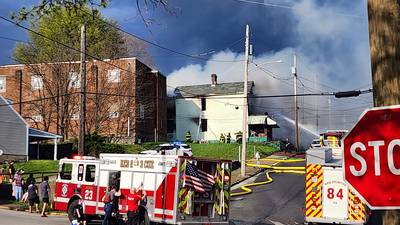 PHOTOS: Smoke, flames billow out of house in Rochester
