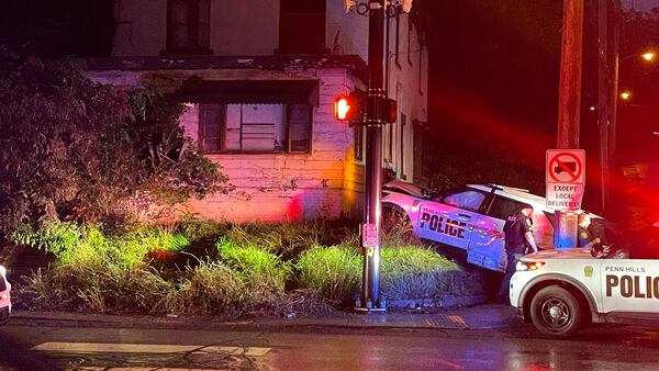 Penn Hills Police cruiser crashes into house in Pittsburgh during chase with armed robbery suspects