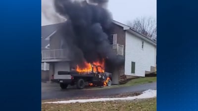 Neighbor springs into action when truck bursts into flames near McDonald home