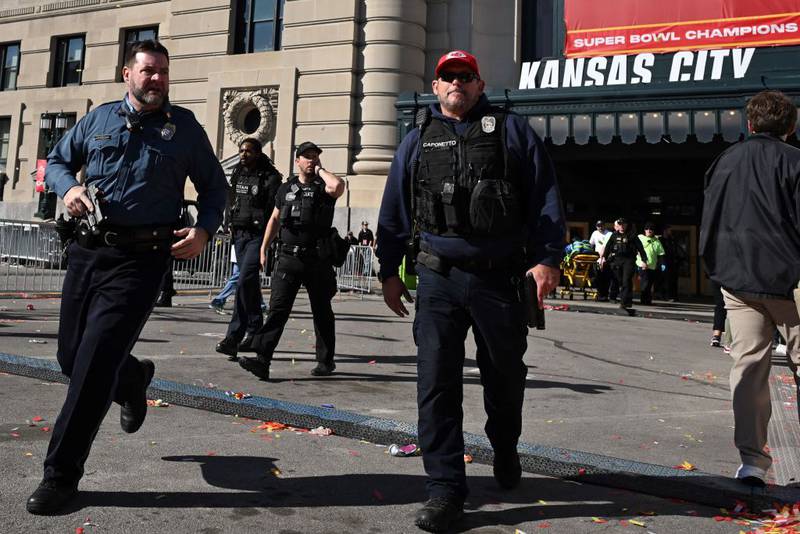 Police respond after shots were fired near the Kansas City Chiefs' Super Bowl LVIII victory parade on February 14, 2024, in Kansas City, Missouri. A shooting incident at a packed parade Wednesday to celebrate the Kansas City Chiefs' Super Bowl victory killed one person and injured nine others, the city fire department said. (Photo by ANDREW CABALLERO-REYNOLDS / AFP) / ALTERNATE CROP (Photo by ANDREW CABALLERO-REYNOLDS/AFP via Getty Images)