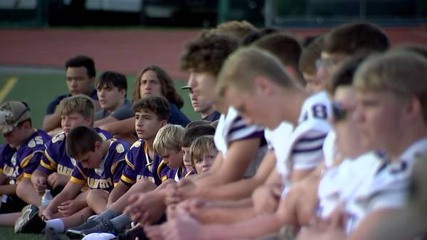 Karns City community holds vigil to support high school quarterback who collapsed during game