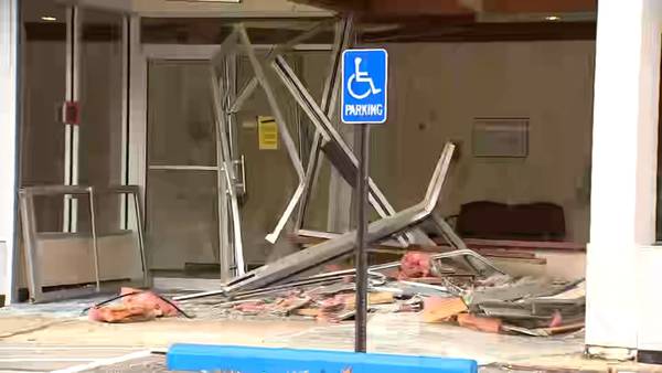 Car crashes into office building in Forest Hills, leaving behind major damage