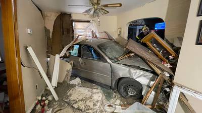 PHOTOS: Car plows through house in Westmoreland County, one person taken to local trauma center