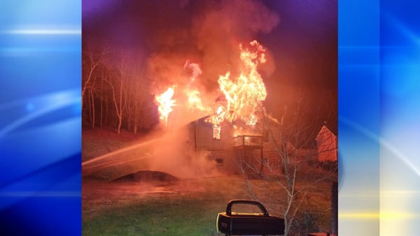 Woman injured after jumping from roof of burning home in Washington County