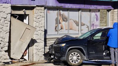 PHOTOS: Car crashes into North Hills AdultMart