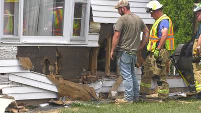 PHOTOS: Vehicle crashes into house in Unity Township