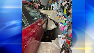 PHOTOS: Garage floor collapses at Penn Hills home