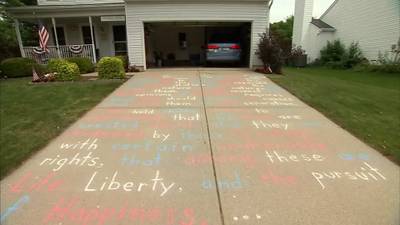 History teacher writes Declaration of Independence on driveway every year