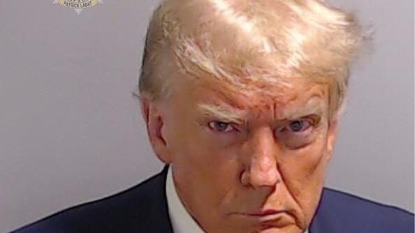 The former president who is facing 91 criminal counts in several jurisdictions is selling holiday wrapping paper that features his scowling face from a mug shot taken in Georgia when he was indicted there.