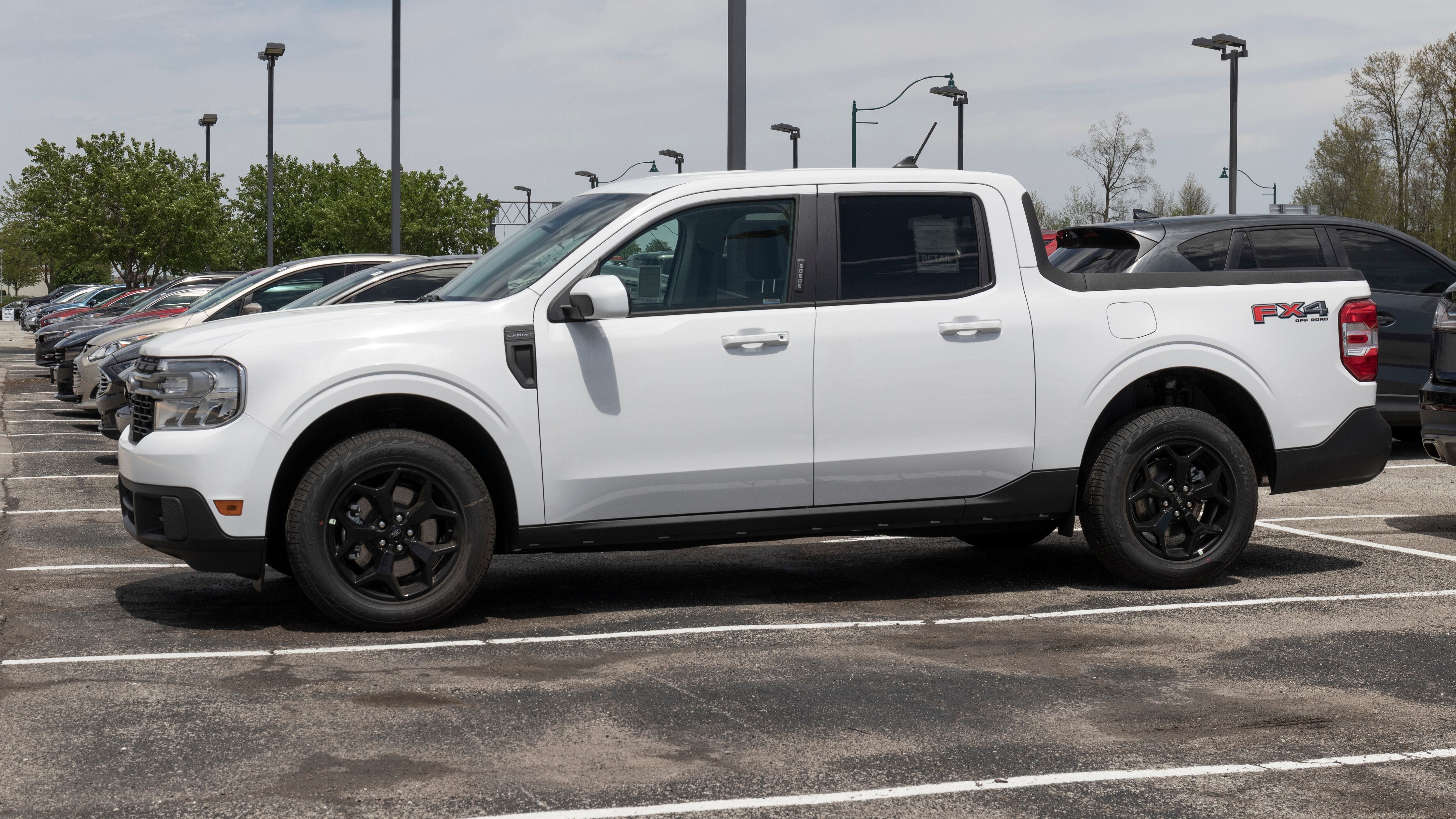 Ford Maverick compact truck display at a dealership. Ford offers the Maverick in XL, XLT and Lariat models.