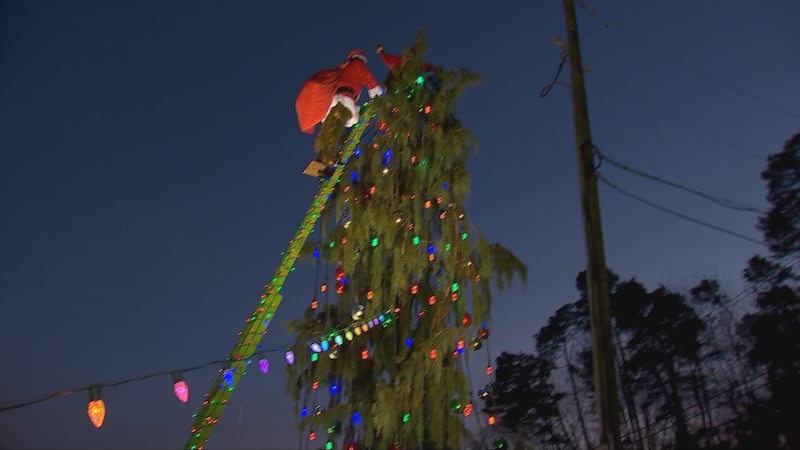 Family working to raise money for spinal rehabilitation by using popular holiday lights display