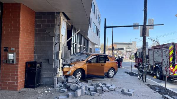 SUV crashes into building in Lawrenceville, sending 1 person to hospital