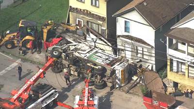 PHOTOS: Driver killed when garbage truck overturns, crashes into several homes in Wilmerding